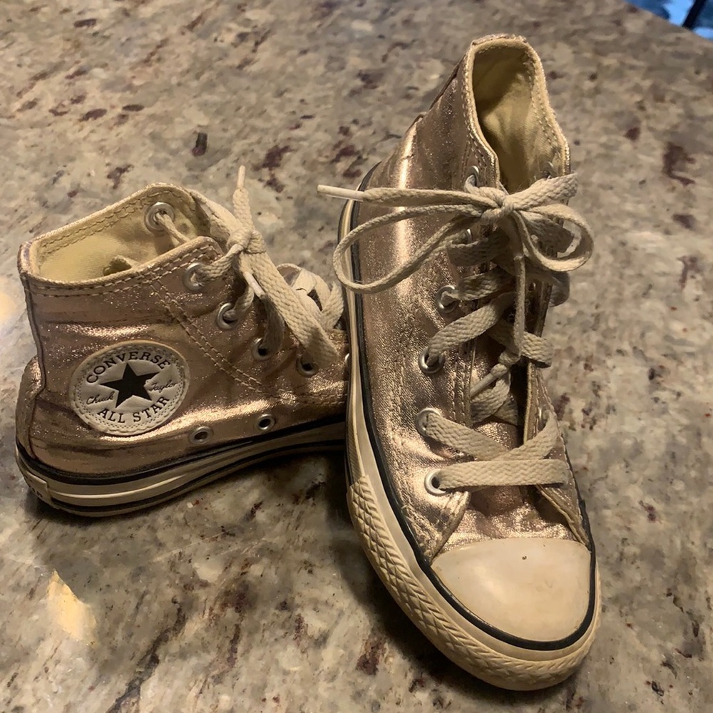 Super cool metallic rose gold high top Chuck Taylors